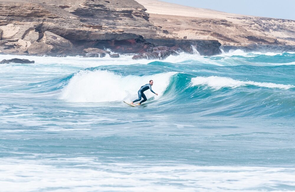 front-view-of-surfer-riding-a-wave-in-a-sunny-day-2023-11-27-04-59-10-utcs.jpg