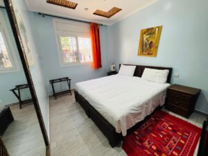 Double room with white sheets and pillows